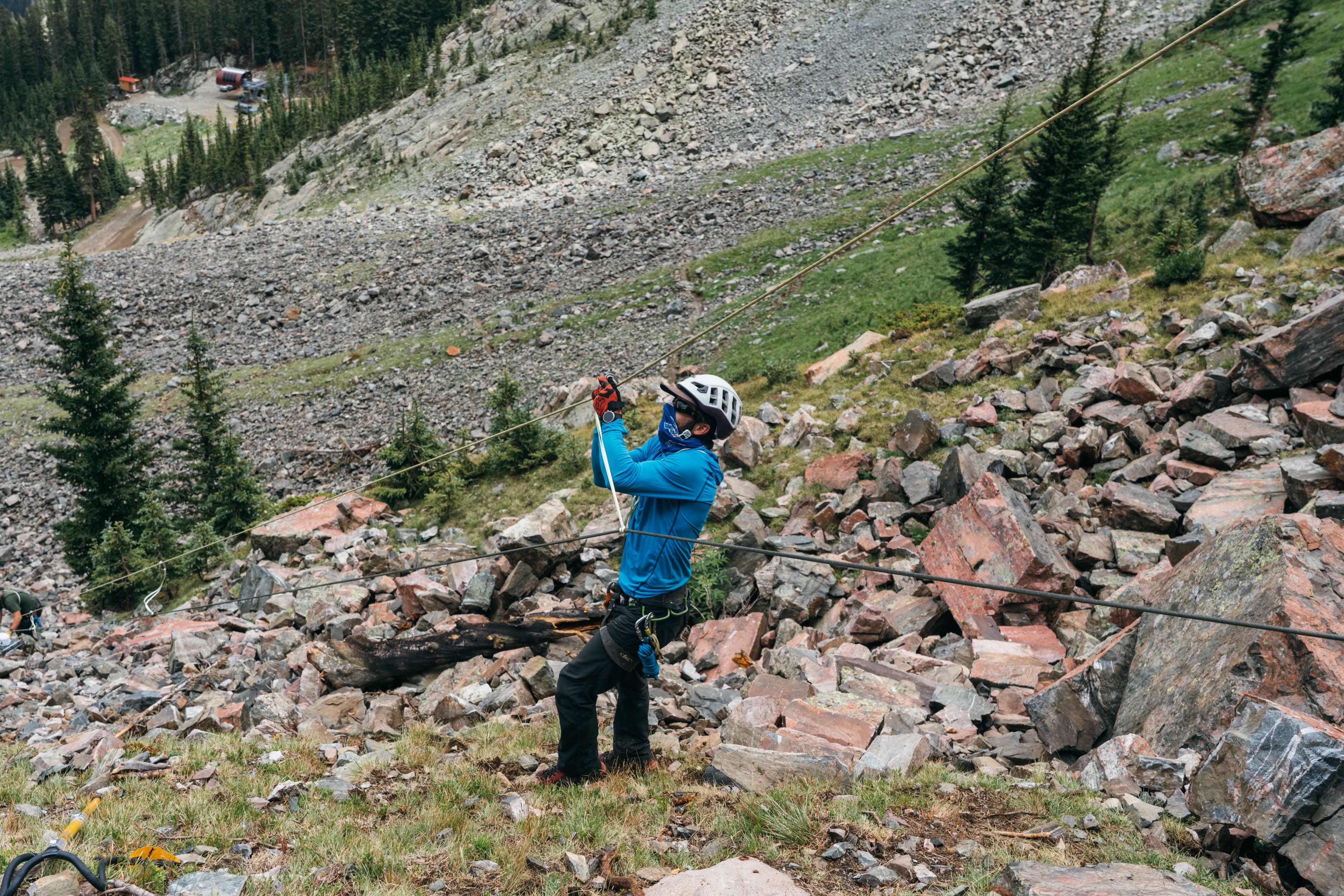 Patrollers practicing a Via Ferrata rescue at Taos Ski Valley.