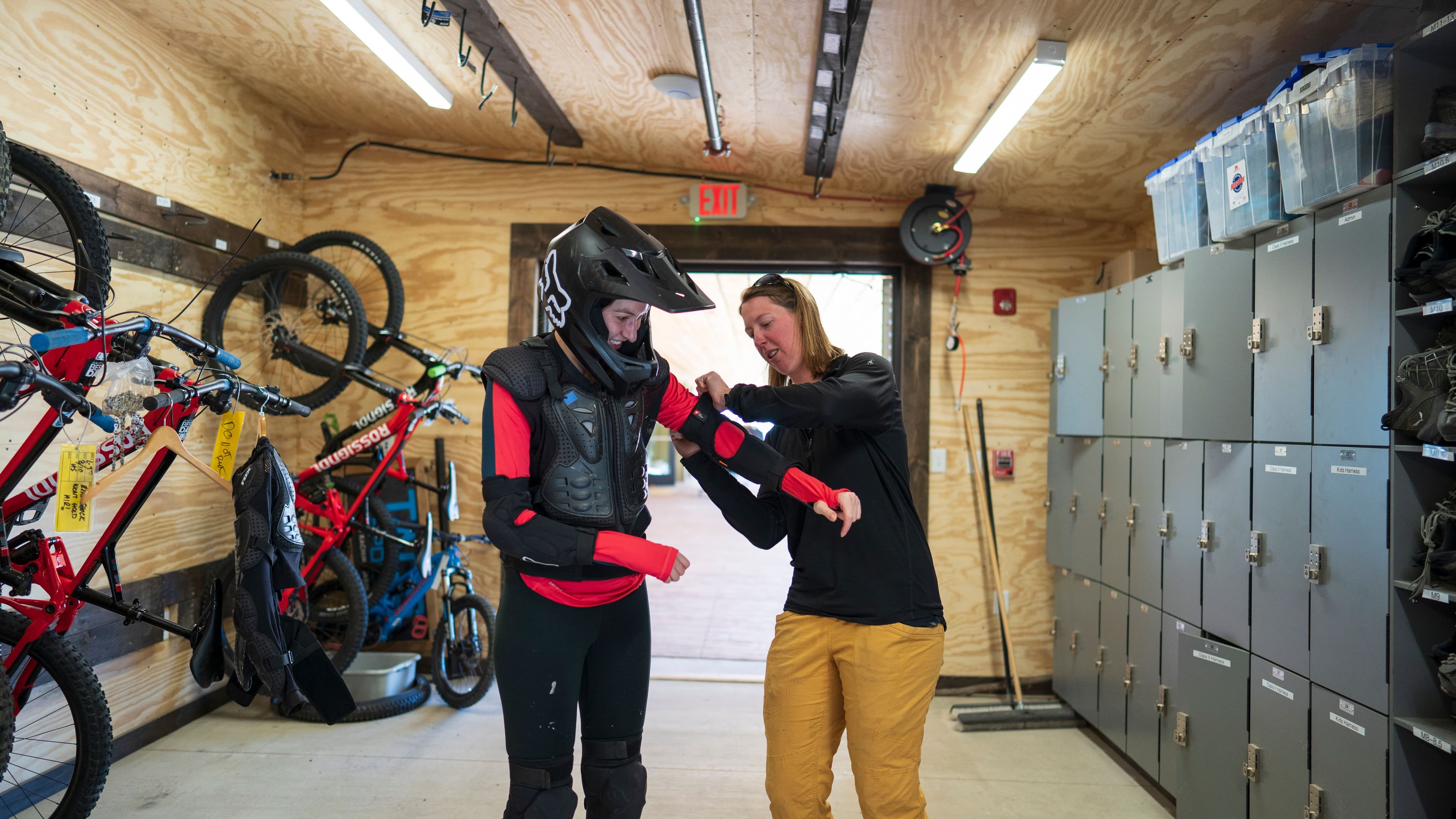 Mountain biker gets suited up with padding at Taos Ski Valley