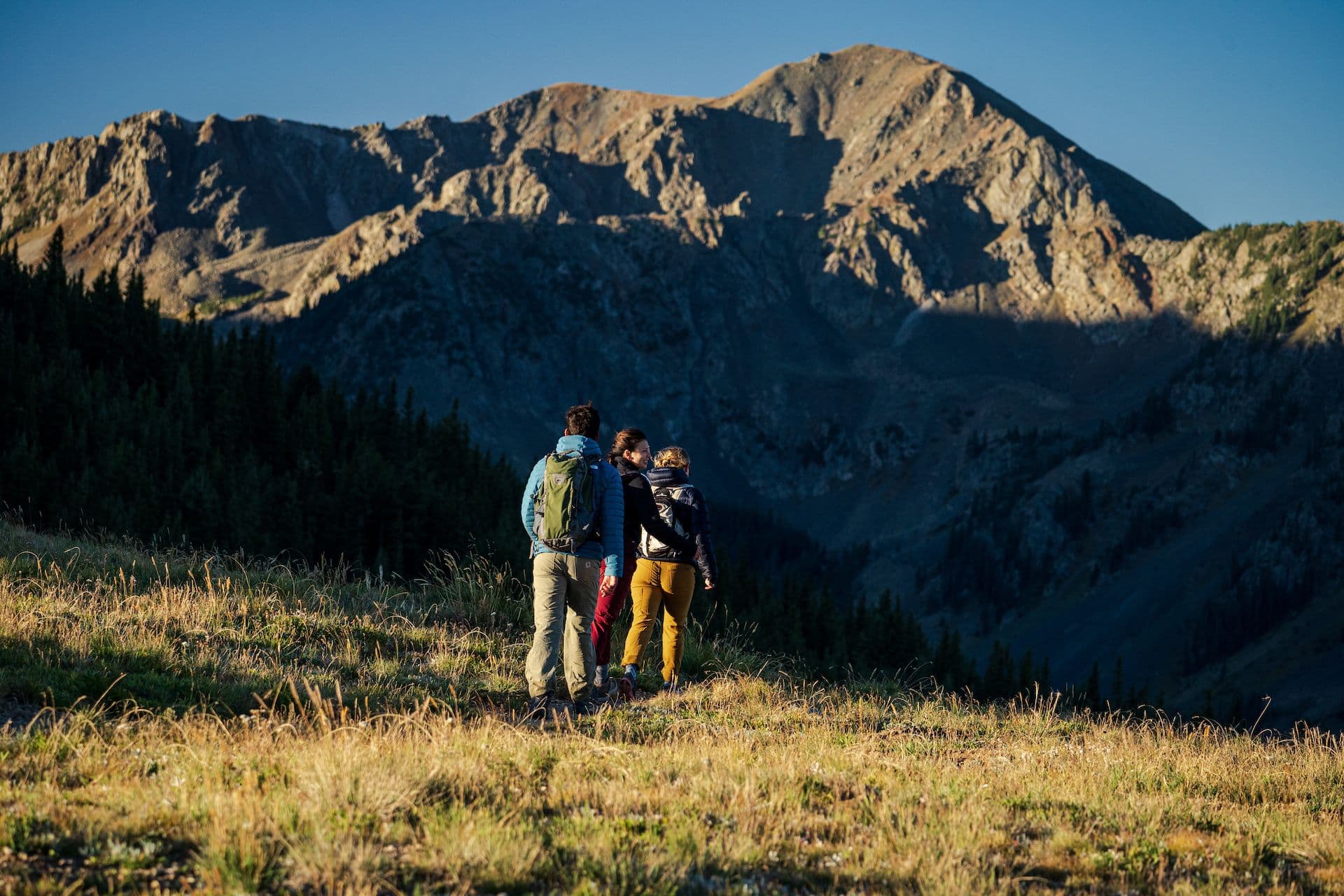 A few hikers hiking the ridge at Taos Ski Valley.