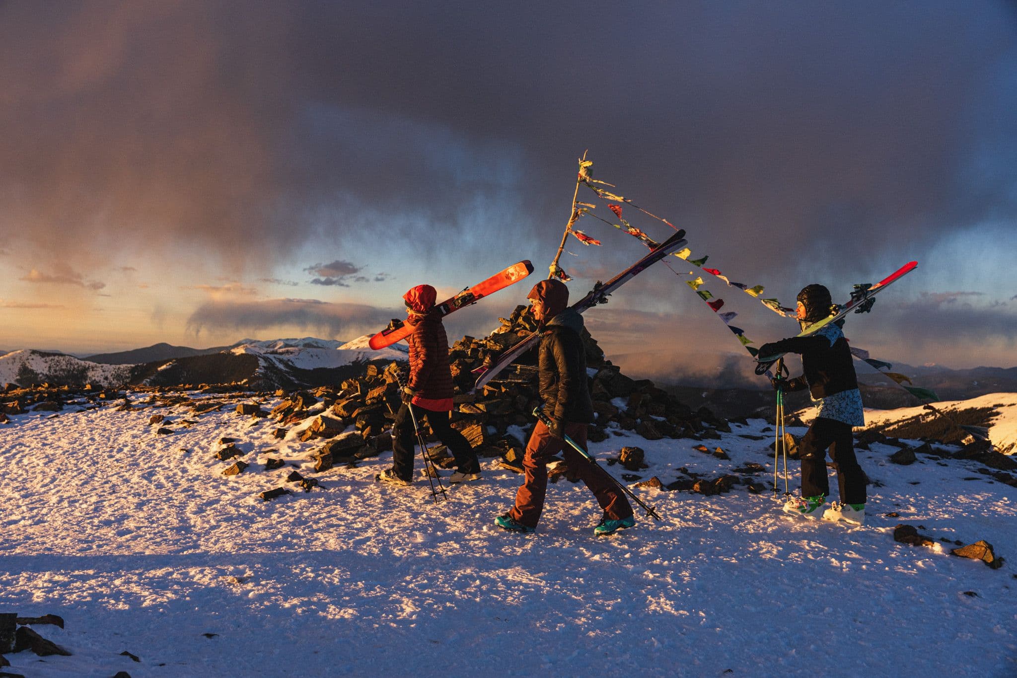 3 women skiiers hiking the Kachina Peak ridgeline at Taos Ski Valley